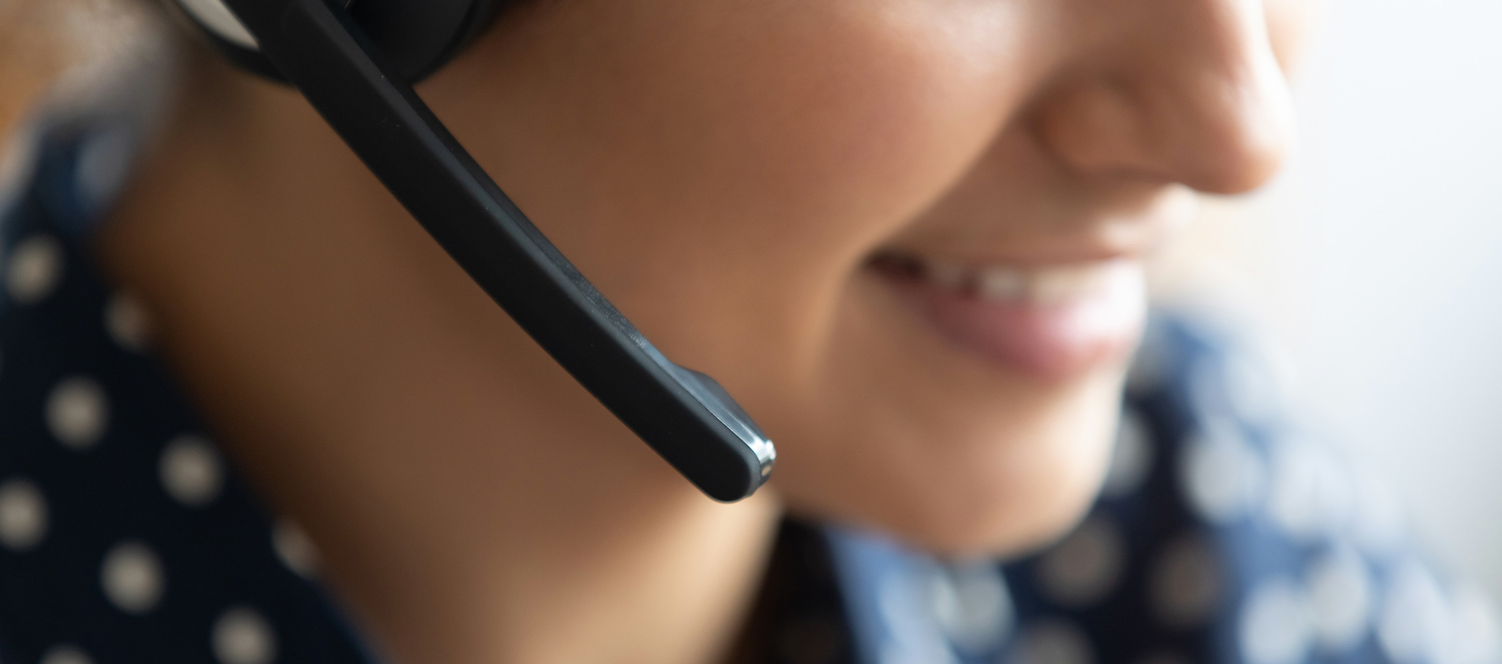 person with headset offering administration support